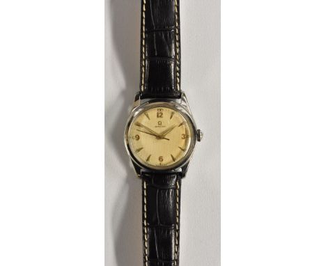 Omega - a retro 1950's wristwatch, textured dial, raised gold quartered Arabic numerals and arrow batons, minute track, centr