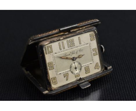 An Art Deco Borel Fils &amp; Cie purse watch, modelled as a rectangular leather covered suitcase, silver case stamped 935, te