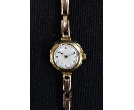 A George V 9ct gold cased bracelet wristwatch, white enamel dial, Roman Numerals, minute track, spade hands, 9ct gold case, i