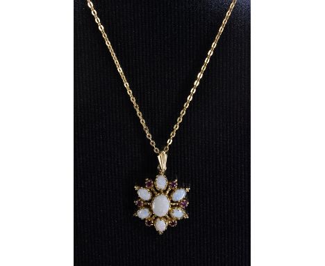 A gilson opal and red spinel floral pendant necklace, central larger oval creamy white opaline stone surrounded by six smalle