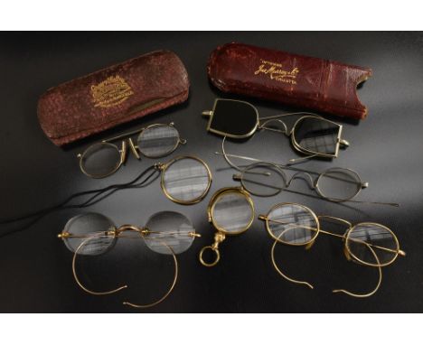 Spectacles - a pair of vintage gilt metal framed oval spectacles, clear nose pads, sprung arms; others steel, folding nose re