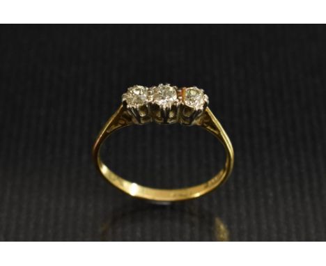 An 18ct diamond trilogy ring ,linear set with three round old brilliant cut diamonds, each approx 0.15ct, total estimated dia