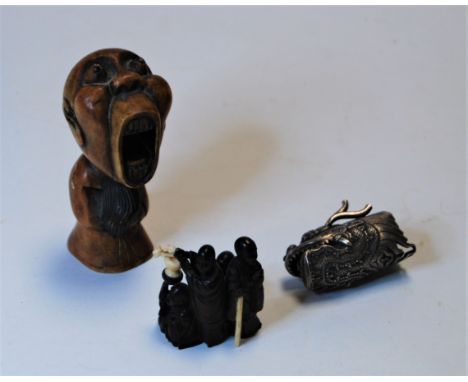 A carved softwood netsuke, carved in the form of four Immortals in varying poses, h.4.5cm; together with a polished hardstone