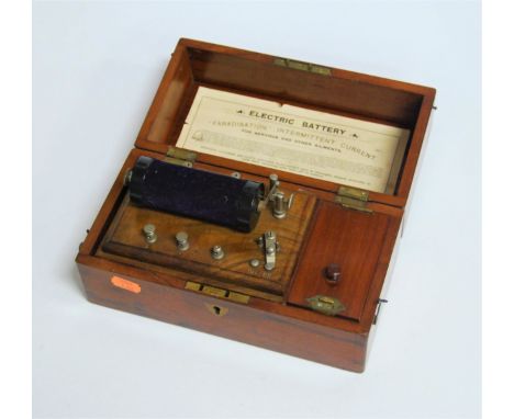 A circa 1900 mahogany cased electric current machine, by the Army &amp; Navy Co-Operative Society, bearing label to the inter
