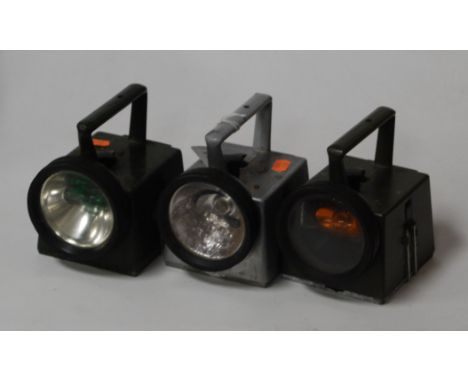 Two green painted military hand-held signal lanterns, each with War Department arrow; together with a British Rail example (3