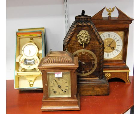 An early 20th century continental oak cased mantel clock, the engraved silvered dial with Roman numerals retailed by Shepherd