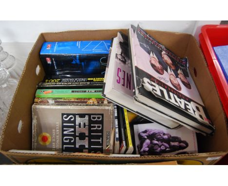 A box of miscellaneous music related books to include Record Collector Price Guide 2004, Beatles - A Celebration, The Rolling