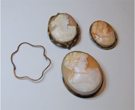 A large Victorian shell carved cameo brooch carved as a female portrait in profile in base metal mount, 6x5cm, together with 