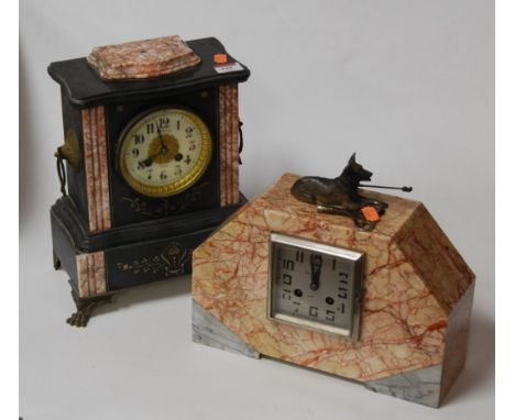 An Art Deco rouge marble mantel clock, having a silvered dial with Arabic numerals and eight day movement, surmounted by a do
