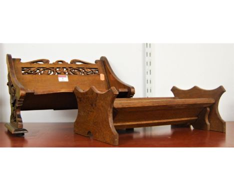 A Victorian stained beech book trough in the form of a bench having fret carved back and ends, width 34cm, together with one 
