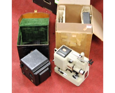 An early 20th century ICA camera housed in a black leather case together with a 20th century film projector