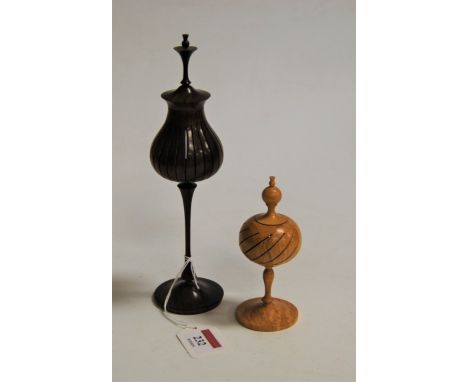 A turned beech pot pourri, having turned finial to a pierced circular body, on further slender turned stem and platform base,
