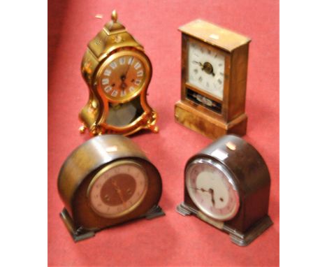 A 1950s Enfield bakelite cased mantel clock, having a silvered chapter ring with Arabic numerals and eight day movement, with