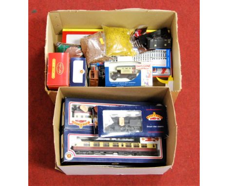 Two boxes containing a quantity of various Bachmann and Hornby boxed locomotives, carriages and accessories, to include a Bac