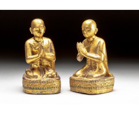 Each youthful figure with a pensive face seated on an oval base decorated with mirrored glass, dressed in a flowing robe with