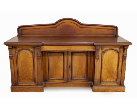 The rectangular breakfront top surmounted by a moulded back gallery above a central frieze drawer, a pair of paneled doors be