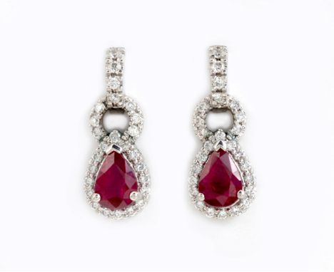 Each claw set with a pear-cut ruby, weighing approximately 1.68cts in total, embellished with round brilliant-cut diamonds we