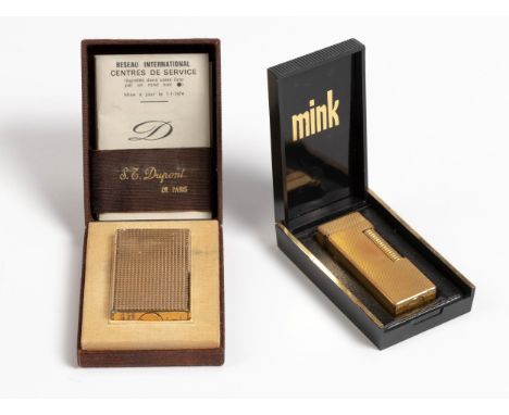 Accompanied by the original box, distress, 5,8cm high; And A Gold Plated Cigarette Lighter, Dunhill, 6,5cm high