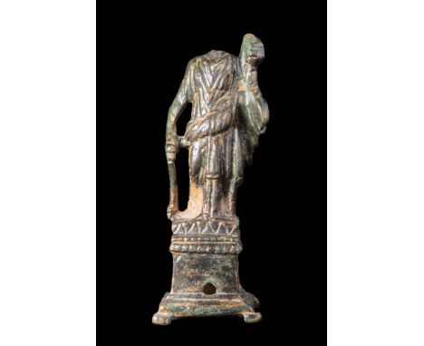 Ca. AD 100 - 300.
A bronze statue of Apollo Citharoedus cast using the lost-wax process. The statue is dressed in a long tuni