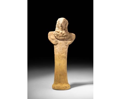 Ca. 2750 - 1900 BC.
A pottery idol of characteristically abstract form depicting a female deity. Her avianesque head presents