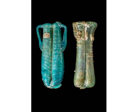 Ca. AD 300 - 500 .
A pair of gorgeous double unguentaria that are free-blown from translucent glass of attractive green hues.