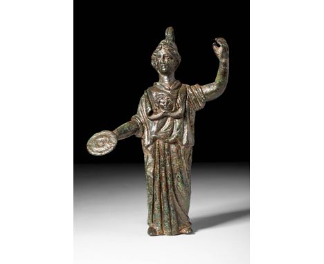 Ca. AD 100 - 200 .
A bronze statuette of Minerva captures her poised and dignified form in an elegant, detailed figure. She w