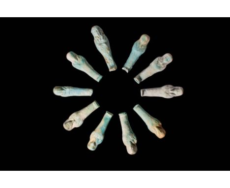 Late Period, Ca. 664 - 30 BC.
A collection of 10 faience ushabtis covered in layers of reflective pale green-hued glaze. The 