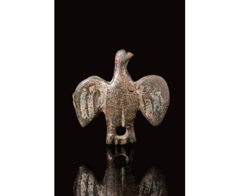 Ca. 200 - 400 BC.
A Late Roman brooch in the form of an eagle with spread wings and it's head turned to one side. The wings a