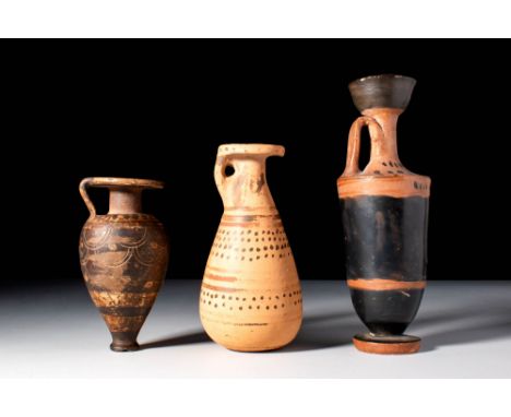 Ca. 650 - 500 BC.
A collection of two Corinthian vessels, a pyriform aryballos adorned with a scale motif on the larger part 