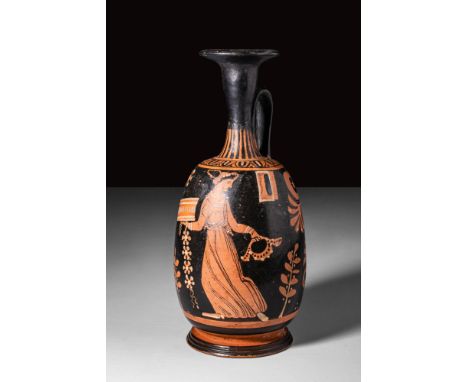 Ca. 400 - 300 BC.
A large squat lekythos, extensively decorated using the red-figure technique, with an elongated globular bo