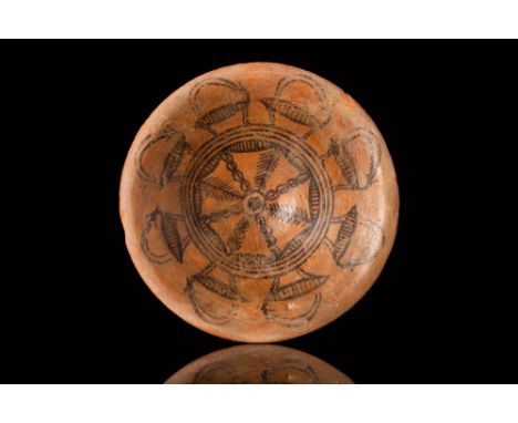 Ca. 3200 - 2800 BC.
A Nal Culture pottery bowl of deep, conical form, painted with geometric motifs in the centre. A processi