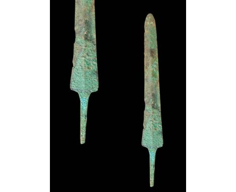 Ca. 1200 - 800 BC.
A cast bronze sword with a large blade bearing sharpened edges and a shallow midrib on both sides. The lon