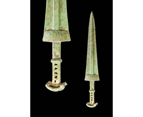 Ca. 1100 - 900 BC.
A bronze dagger made using the lost wax casting technique. It has a slender blade with a high midrib and a