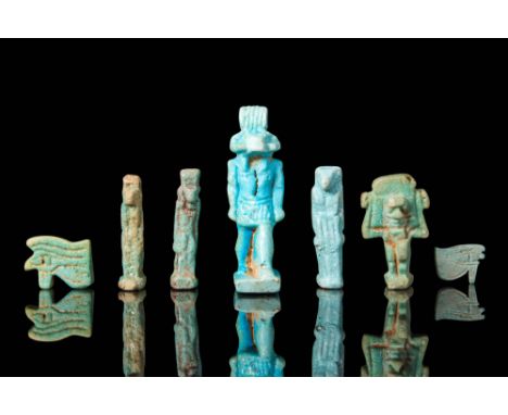 Late Period, Ca. 664 - 30 BC.
A collection of seven blue and pale green faience amulets depicting Egyptian deities represente