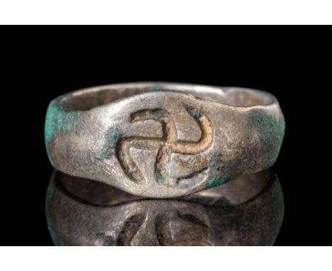 Ca. AD 100 - 300.
A silver ring with a D-section round hoop enlarged on the shoulders to form a bezel engraved with a central