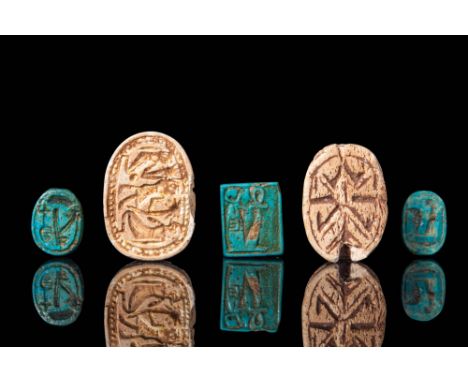 Middle Kingdom, Ca. 2055 - 1790 BC.
A collection of scarabs and a seal includes four distinct scarabs. The first scarab featu