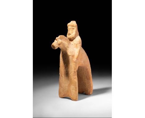 Ca. 750 - 600 BC.
A pottery sculpture of an unusual form featuring a rider and horse, all delineated in an abstract style cha