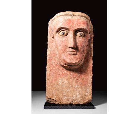 Ca. 100 BC - AD 100.
A carved from limestone, a high-relief stela featuring a prominent abstract face with a slender triangul