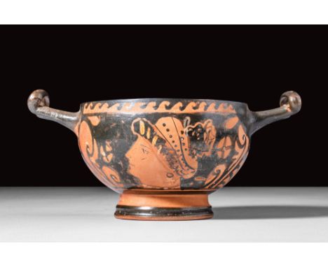 Ca. 350 - 300 BC.
An Apulian red-figure skyphos of a classic form probably of from the circle of the Chevron Group, presentin