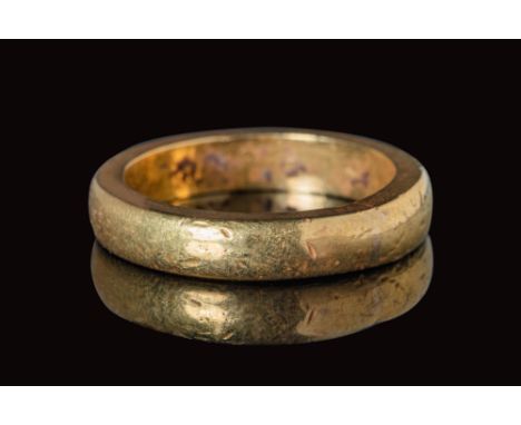 Ca. AD 400 - 600.A solid gold finger ring with a round hoop with polygonal section and polished surface. For similar see: The