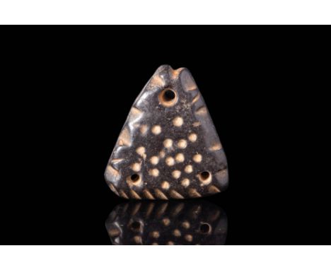 Ca. 2000 - 1000 BC.
An Anatolian black stone amulet, pierced through the mouth. It depicts a flat fish of triangular shape, t