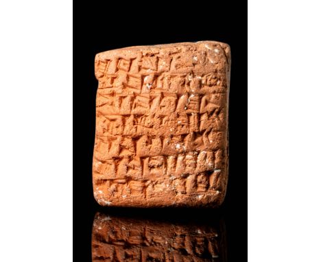 Ca. 2100 - 1500 BC.
A petite clay tablet with a lightly convex obverse face, and rounded peripheries. The tablet displays sev