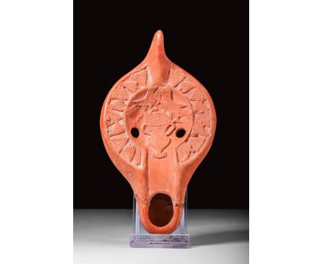 Ca. AD 400 - 600.
A very fine and beautifully moulded bright red terracotta oil lamp featuring an intricately decorated discu