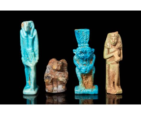 New Kingdom, Ca. 1550 - 1069 BC.
A collection of faience amulets comprising a tall green faience figure of Thoth, represented