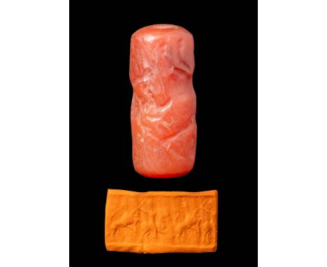 Ca. 1200 - 900 BC.
A cylinder seal made out of carnelian. It depicts a frieze of mythological rampant creatures fighting agai