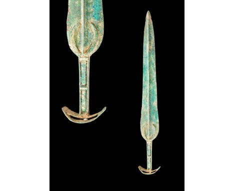 Ca. 1100 - 900 BC.
A bronze dagger made using the lost wax casting technique. It has a slender blade with a high midrib and a