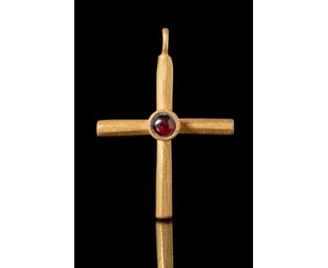 Ca. AD 600 - 700.
A gold cross with cylindrical arms. Each arm of the cross is rounded in profile, creating a distinctive, sc