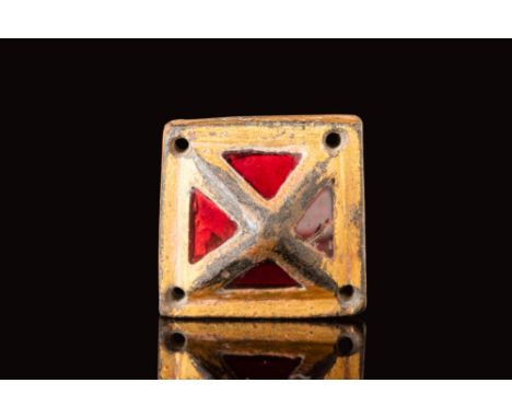 Ca. AD 600.
A rare Anglo-Saxon or Merovingian gilt sword fitting, in the shape of a pyramid, inlaid with red garnets on each 