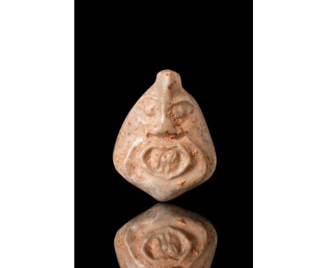 Ca. 1200 - 800 BC.
An amulet of grey stone. It rests on a flat base and one end, where it is pierced, is the face of a mouse 