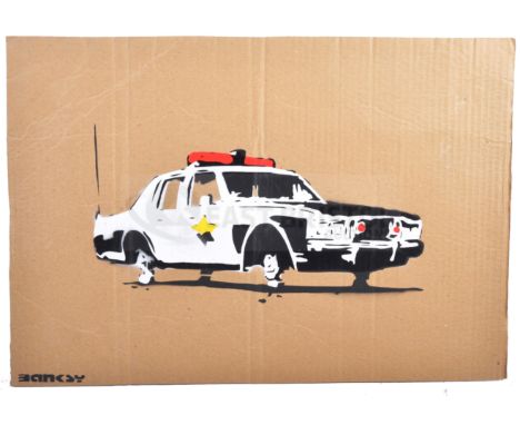 BANKSY - Dismaland, 2015Cop CarHand sprayed stencil graffiti on cardboard Ed. 3/3Reverse in marker: smiley face - Enjoy Your 